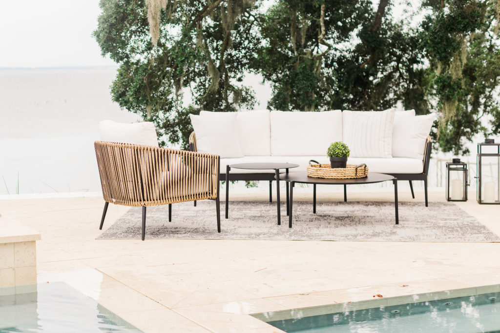 Havana seating beside a pool under live oaks