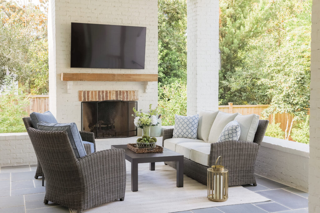 Cove deep seating around a covered outdoor fireplace
