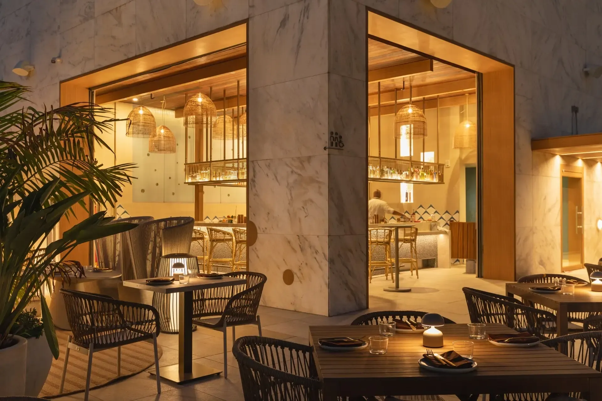 Outdoor dining beside the hotel bar at night